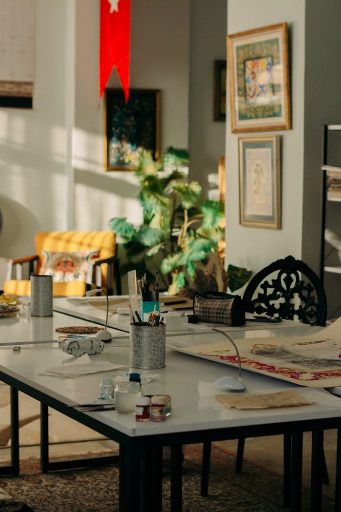 Sunlit art studio with supplies and decor, offering a creative ambiance.