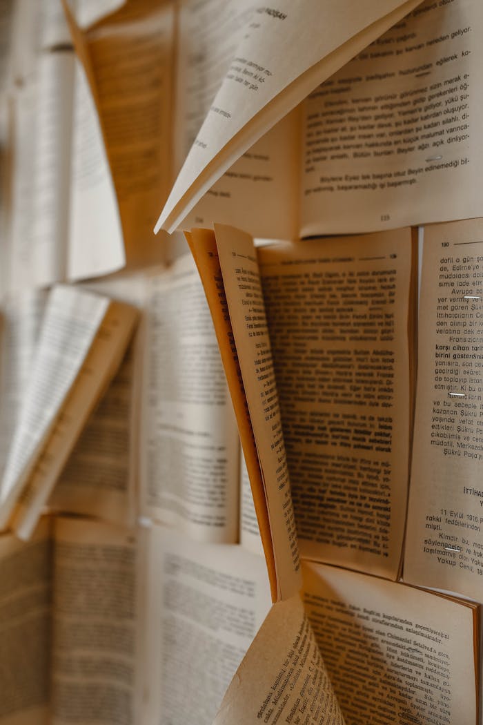 A creative arrangement of open books with visible pages, ideal for literary and artistic themes.